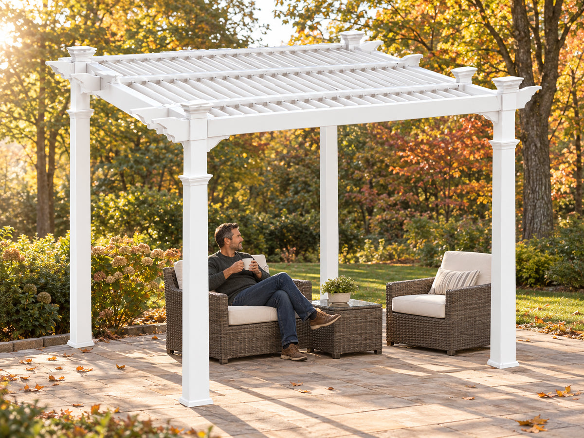 Vinyl Pergola Designed, a man sitting under the pergola with a coffee mug, doing nothing to the structure — just at ease